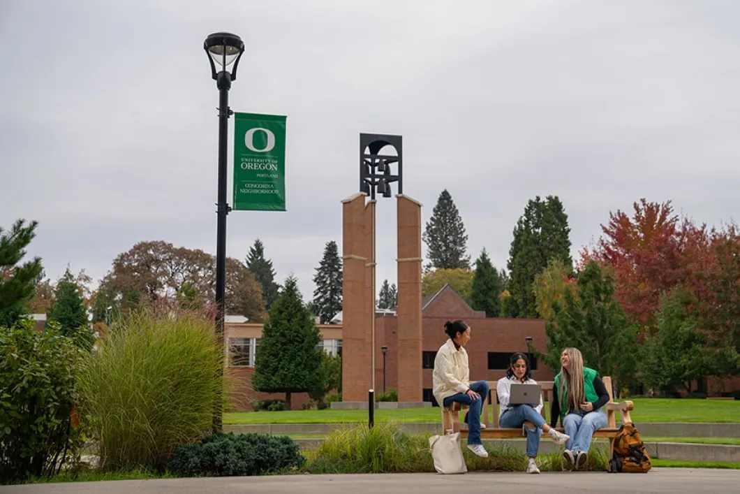 UO Portland Campus with students on a bench