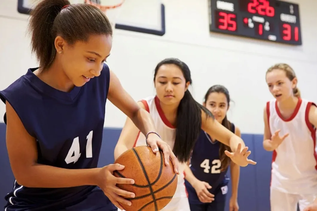 Girls playing basketball