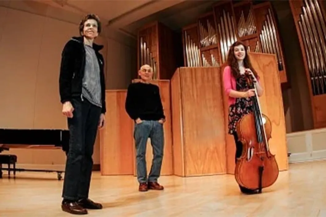 Mark and Mari Dembrow with student holding cello