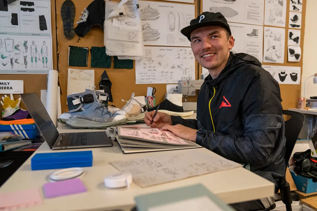 Product Design student sitting at a desk