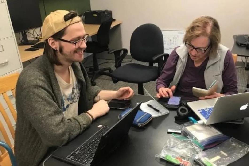 Student working with professor on Latinx studies