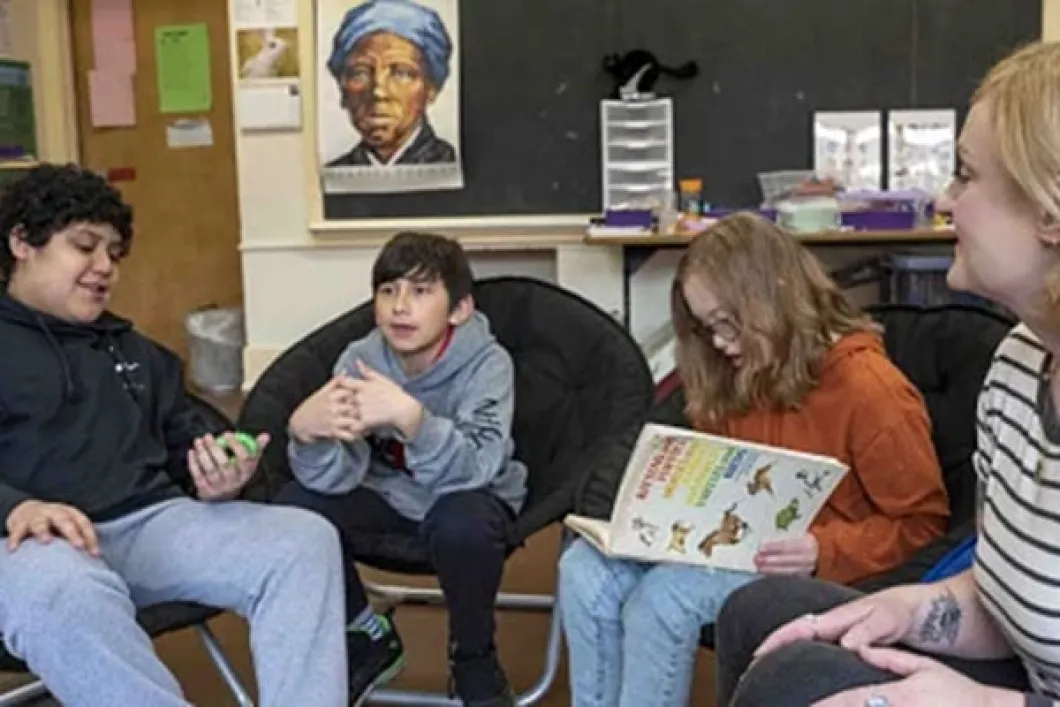 School teacher with young students