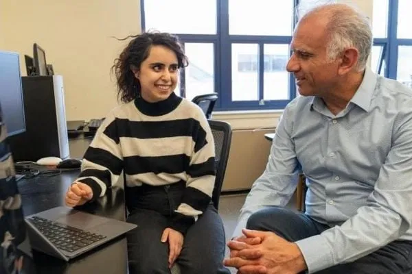 Saghar Salehi talking with professor