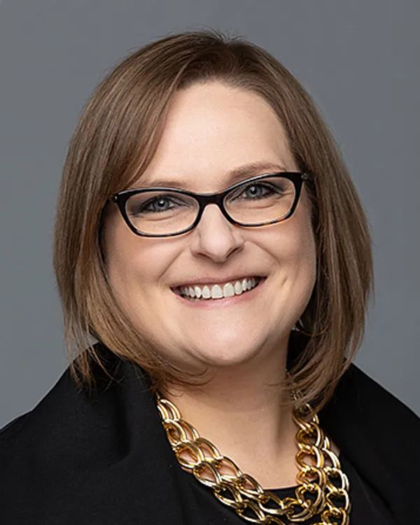 White middle aged woman smiling headshot