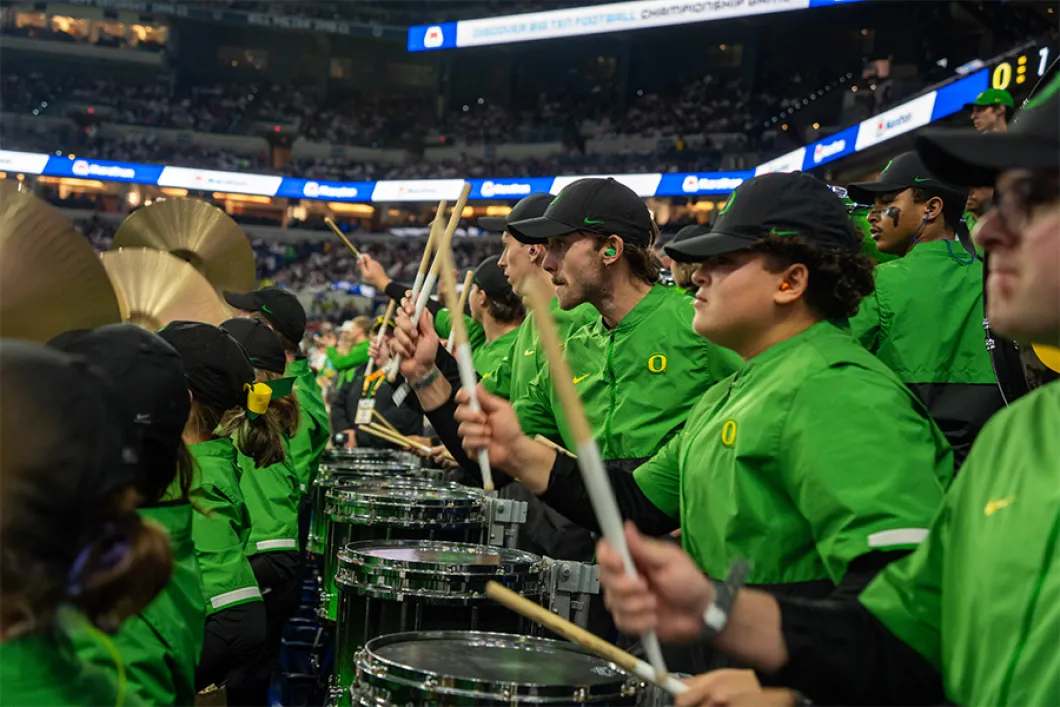Students in UO drumline in the midst of playing in Matthew Knight Arena