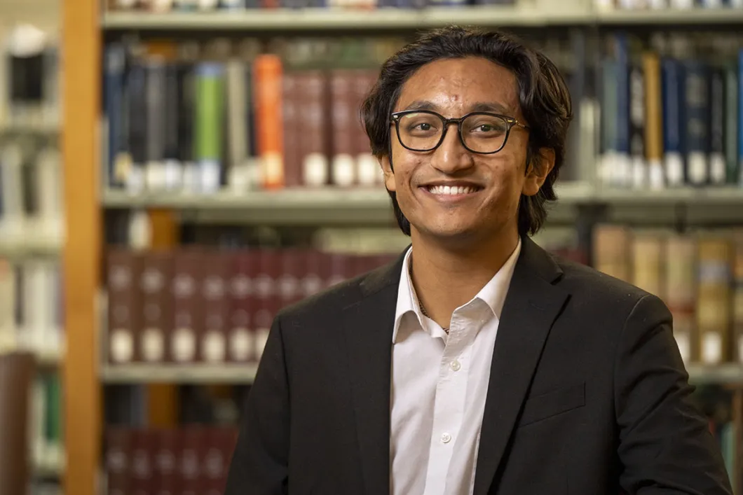Headshot of Kavi looking into the camera and smiling