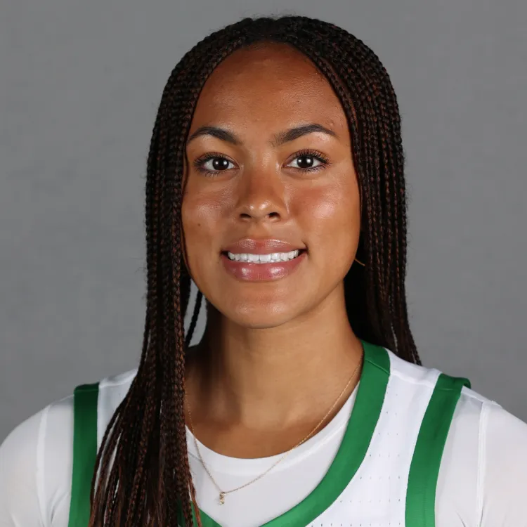 A woman with long dark hair and a basketball jersey