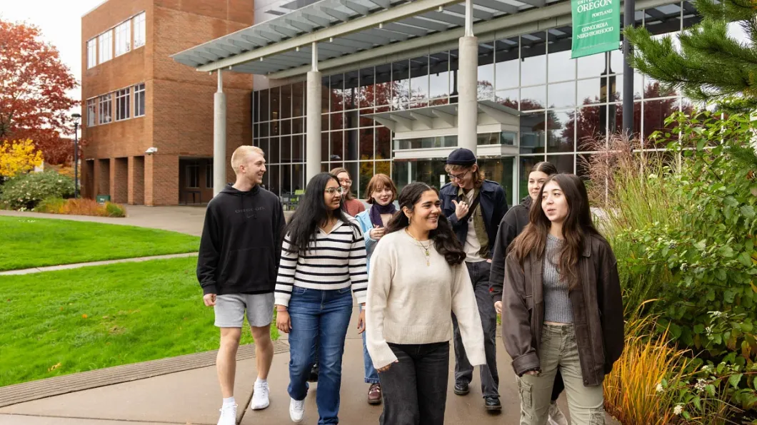 Students walk near the Ballmer Institute. 