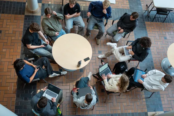 Members of the Real Estate Investment Group talk with one another during the first Spring term meeting of the group.