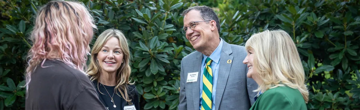 Parents talking with UO President Karl Scholz
