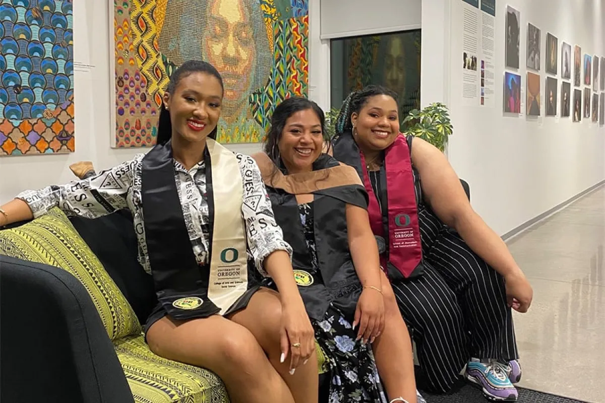 Three female University of Oregon BCC Alumni sitting on a couch
