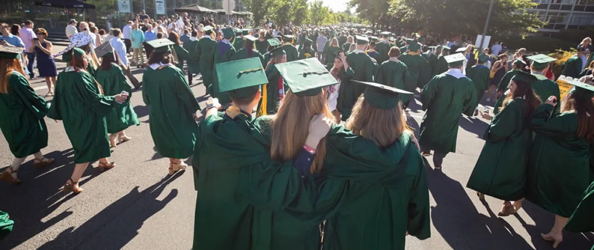 A group of students walking together at commencement