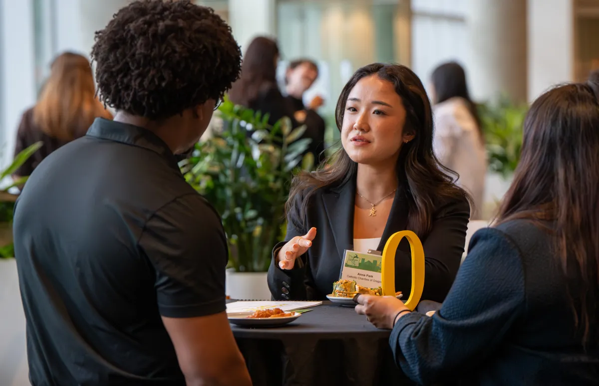 Anna Park converses at a reception. 