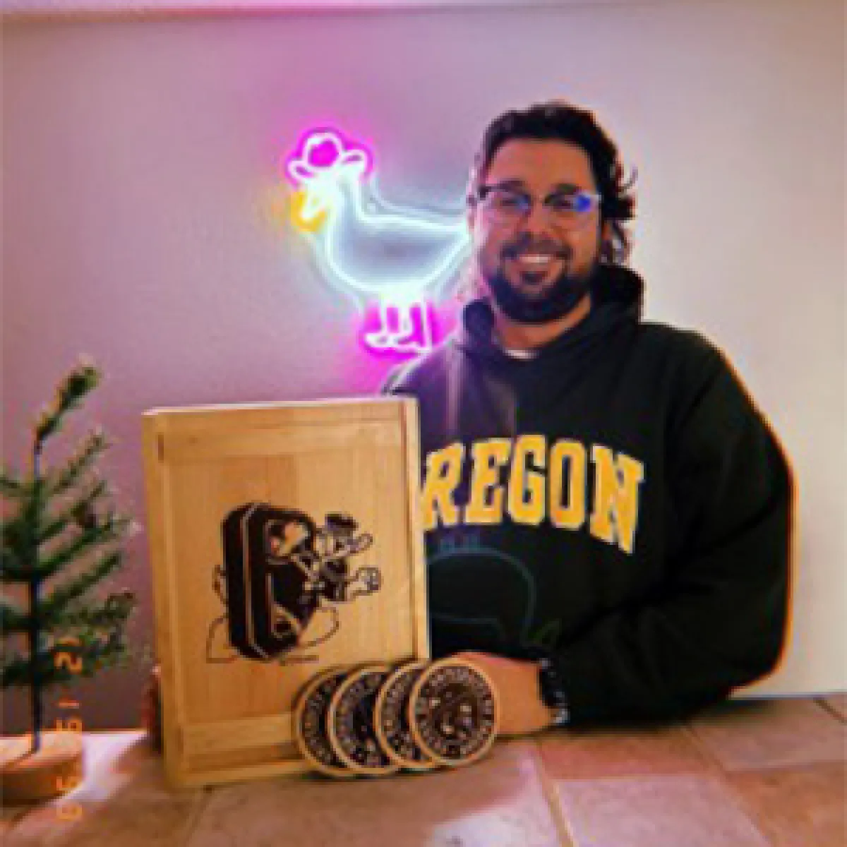 Man holding a Ducks-themed wine box