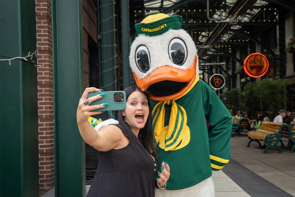 Woman taking a selfie with the Duck at 5th Street Market Alley